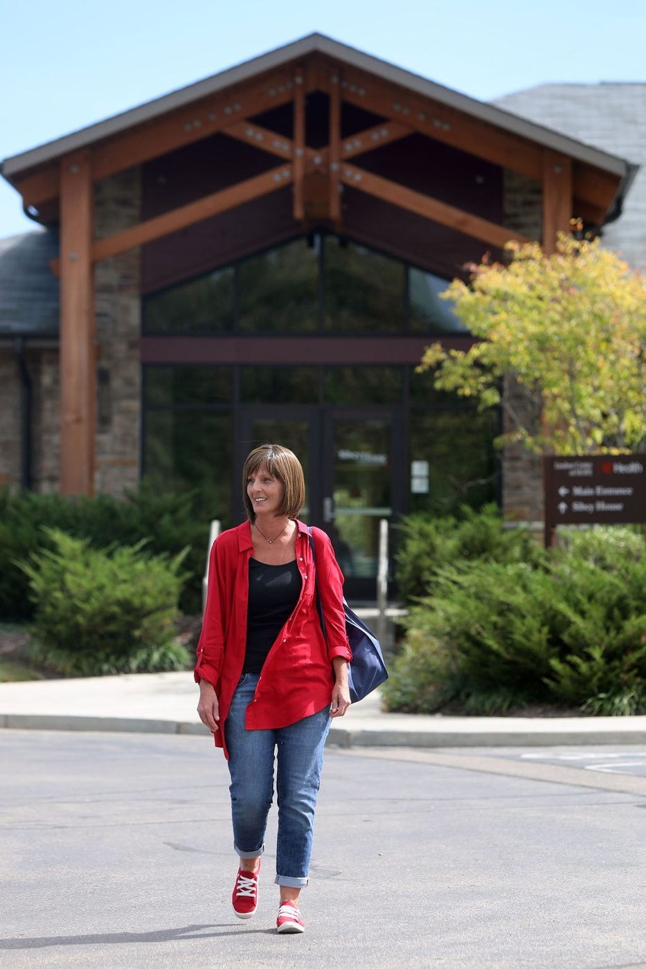 Person walking outside the Sibcy House entrance