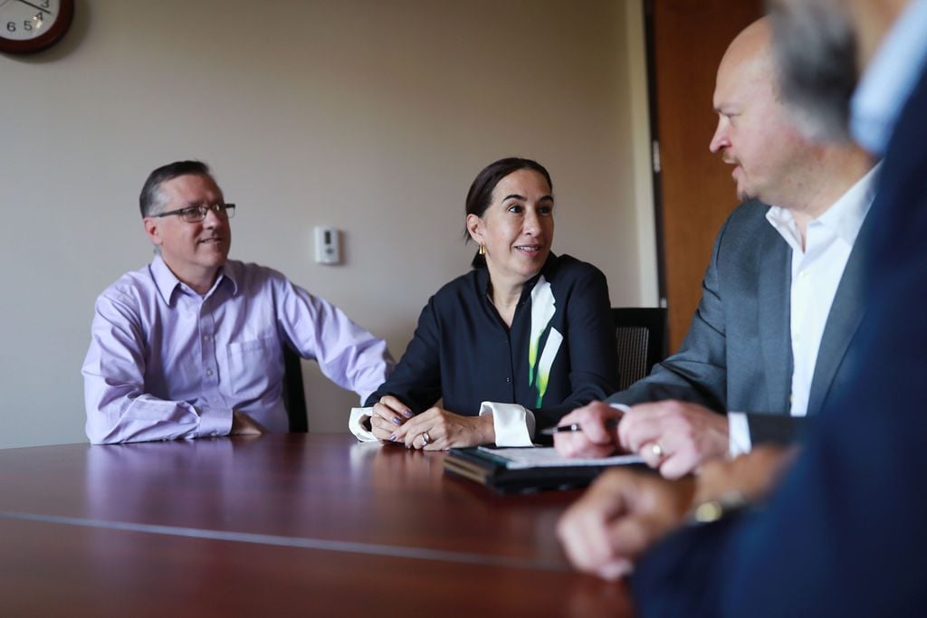 Sibcy House care team meeting around a table